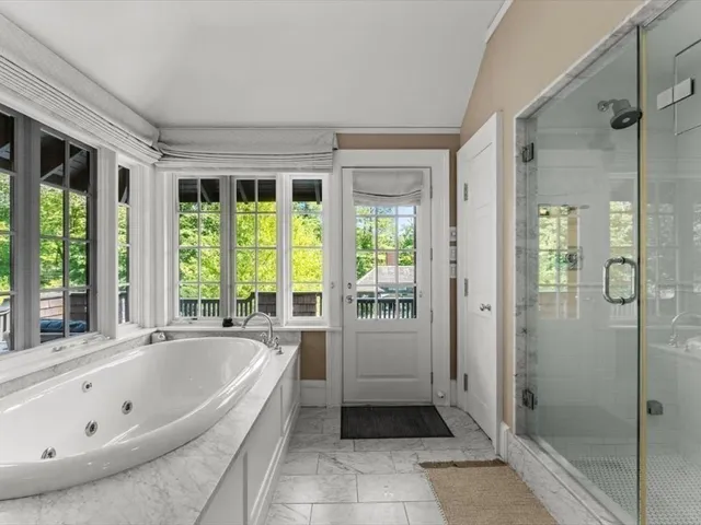 a bathroom with a bathtub and a shower