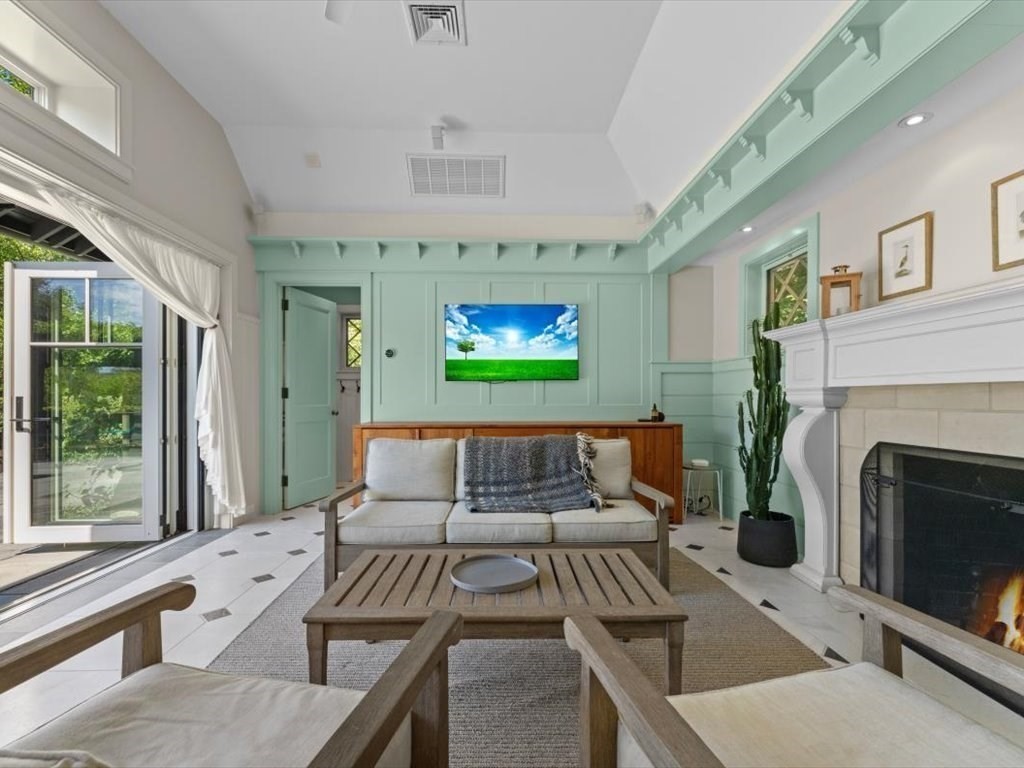 159 Bridge Street Manchester, MA 01944 - Photo 29 of 42 a living room with furniture and a fireplace