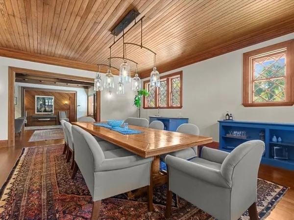 a dining room with furniture and window