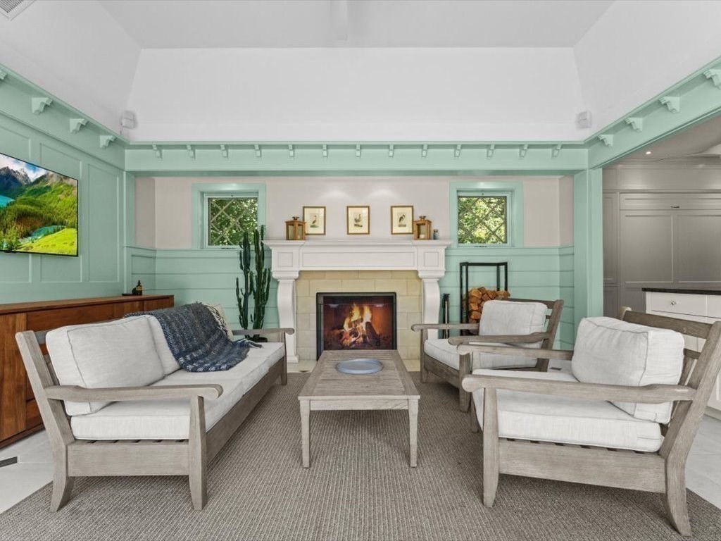 159 Bridge Street Manchester, MA 01944 - Photo 31 of 42 a living room with furniture and a fireplace