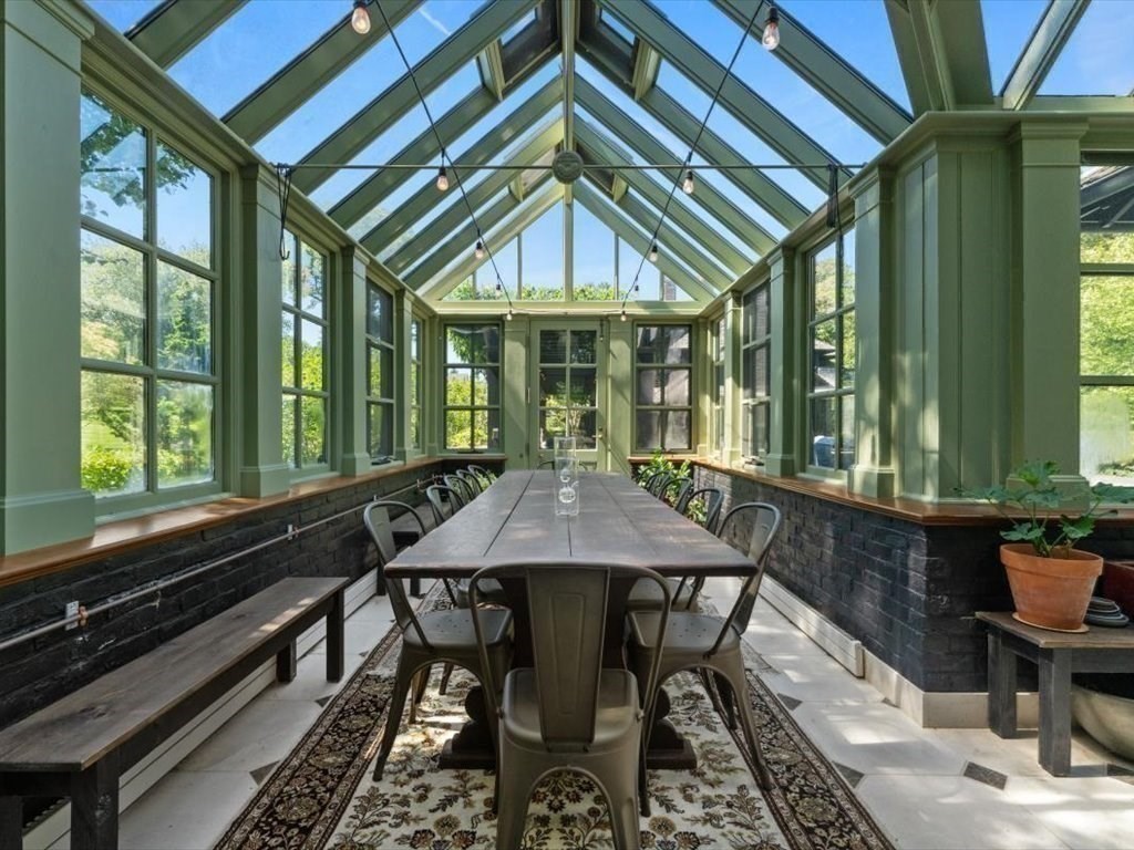 159 Bridge Street Manchester, MA 01944 - Photo 34 of 42 a dining room with furniture a chandelier and a rug