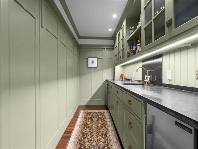 a kitchen with a sink and cabinets