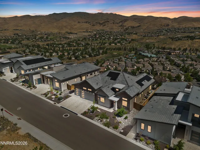 an aerial view of a house with a mountain view