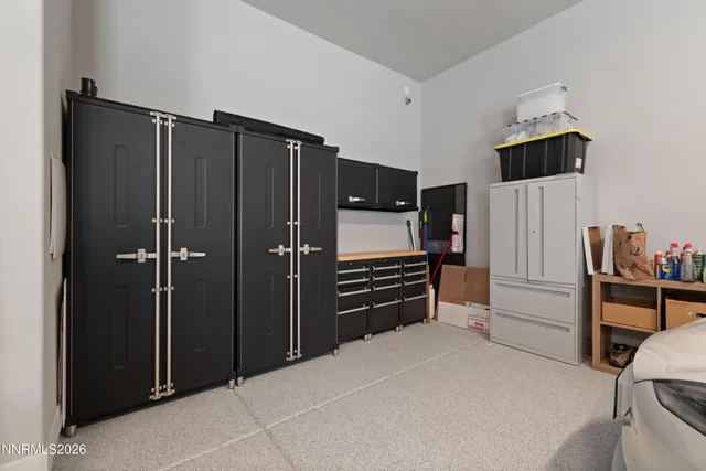 a view of a refrigerator in kitchen and an empty room