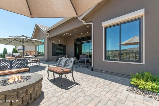 a outdoor space with a couch and chairs