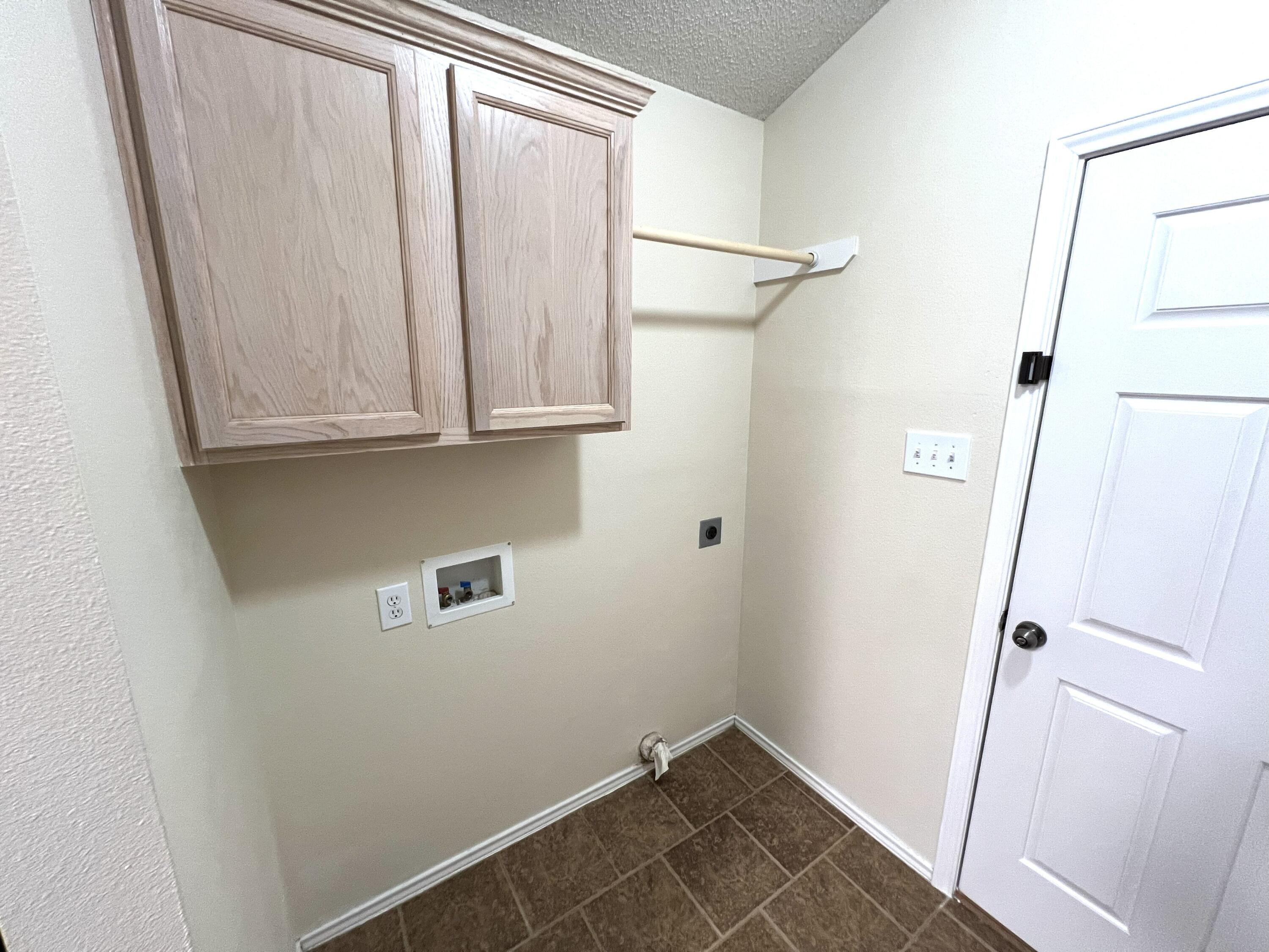 1707 76th Street Lubbock, TX 79423 - Photo 12 of 19 a view of a storage and utility room with a fireplace