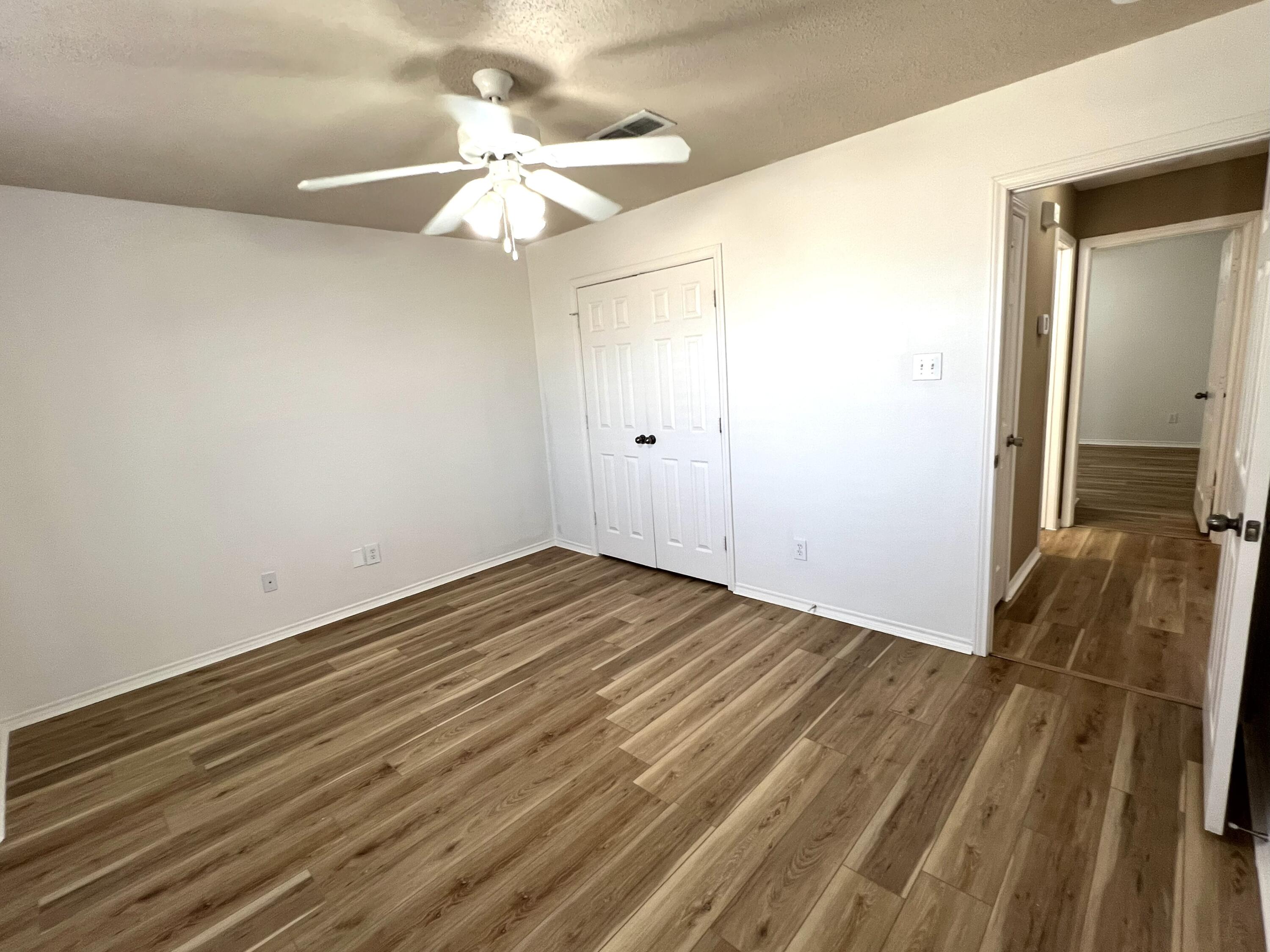 1707 76th Street Lubbock, TX 79423 - Photo 5 of 19 a view of a livingroom with wooden floor