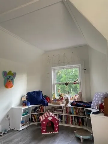 a room with furniture and a large window