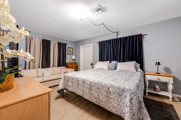 a bed room with a bed and a lamp