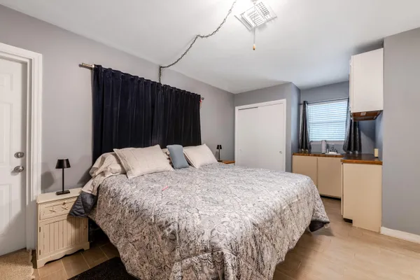 a bedroom with a bed and a view