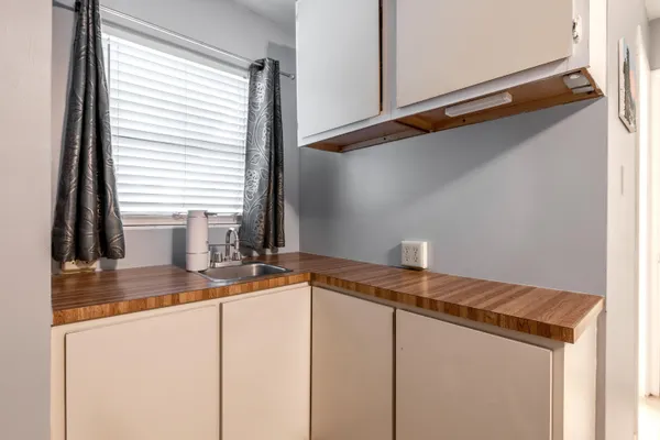 a kitchen with a sink and a window