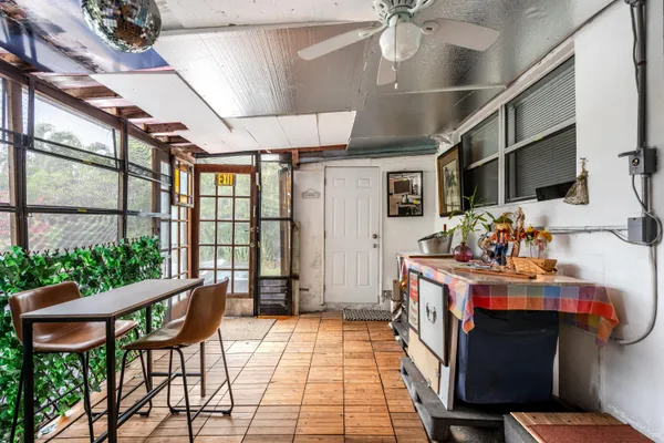 a view of a chairs and potted plant in a room