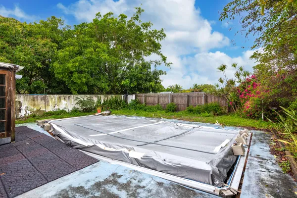 a view of a backyard with sitting area
