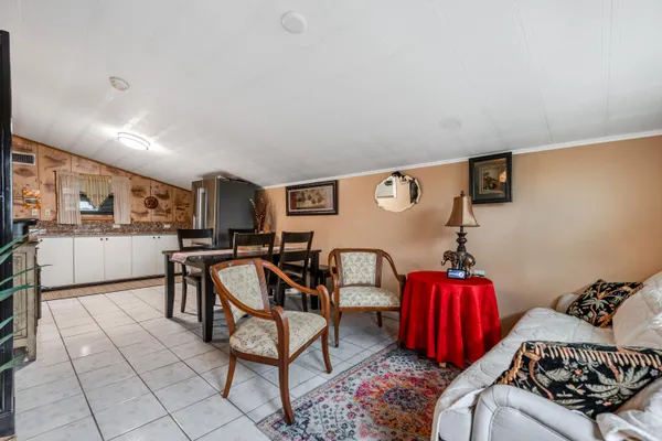 a living room with furniture and a table