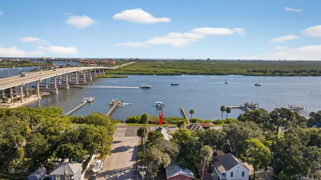 a living room with furniture a ceiling fan and a rug