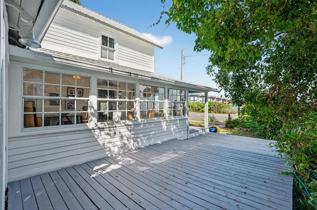 a kitchen with stainless steel appliances granite countertop a refrigerator a stove and a wooden floors