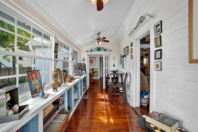 a bathroom with a sink a toilet a mirror and shower
