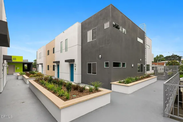 a front view of a house with outdoor space and sitting area