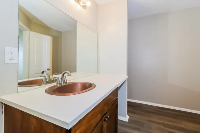 a bathroom with a sink and a mirror