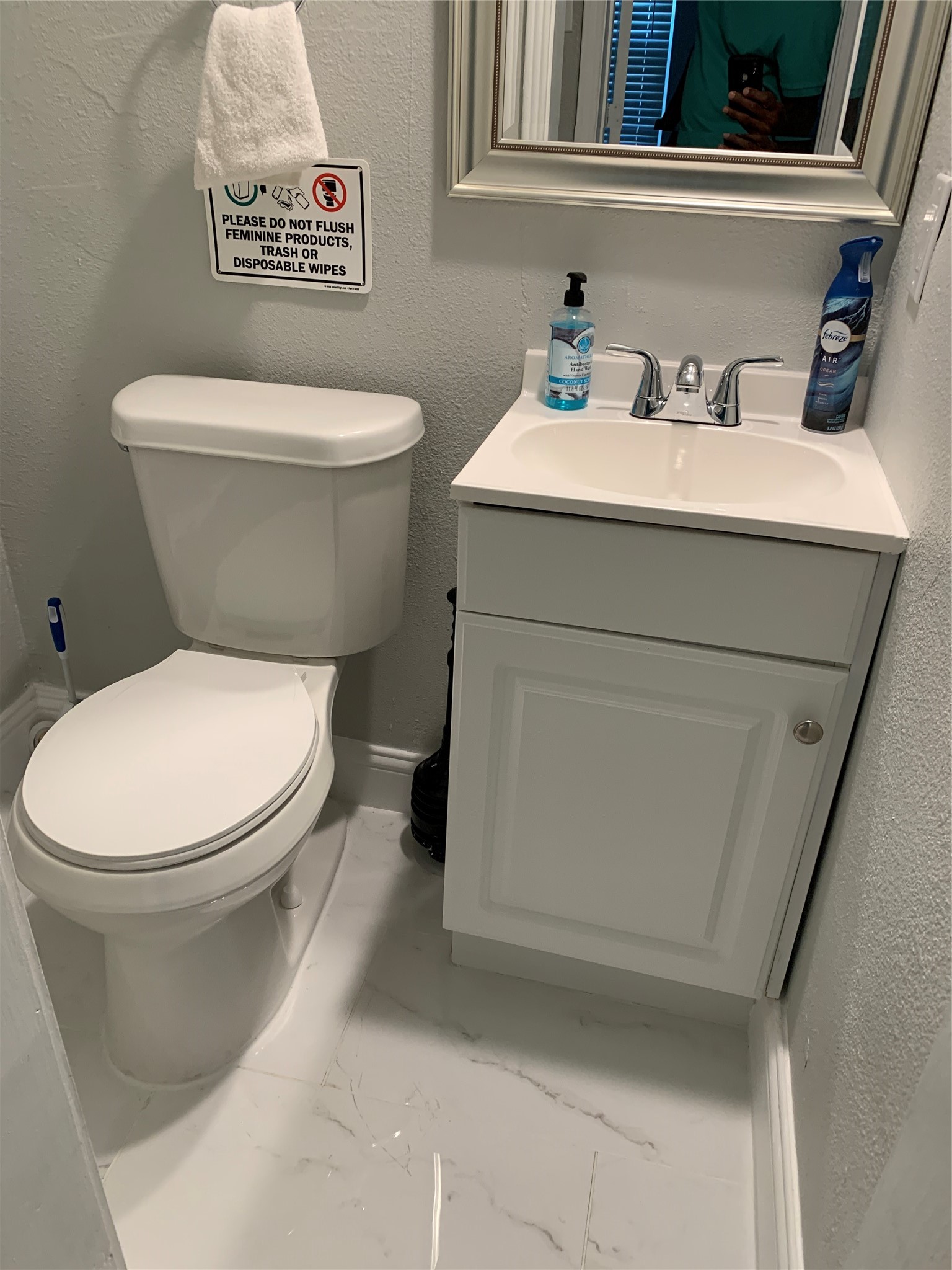 1909 Ruth Street Houston, TX 77004 - Photo 21 of 35 a white toilet sitting next to a bathroom sink