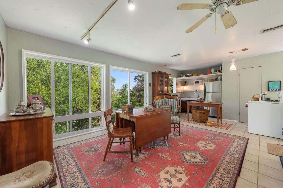 20 North Peak Road West Lake Hills, TX 78746 - Photo 11 of 18 a living room with furniture a rug and a floor to ceiling window