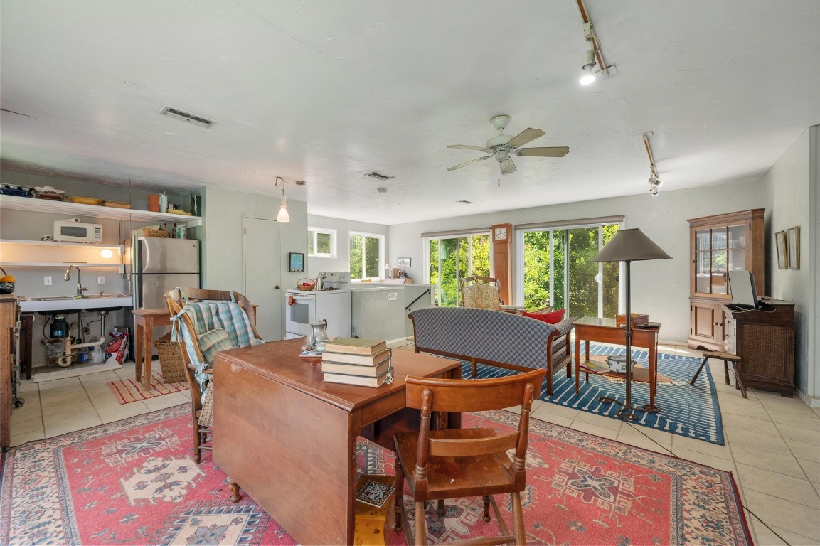 20 North Peak Road West Lake Hills, TX 78746 - Photo 12 of 18 a view of a dining room with furniture window and wooden floor