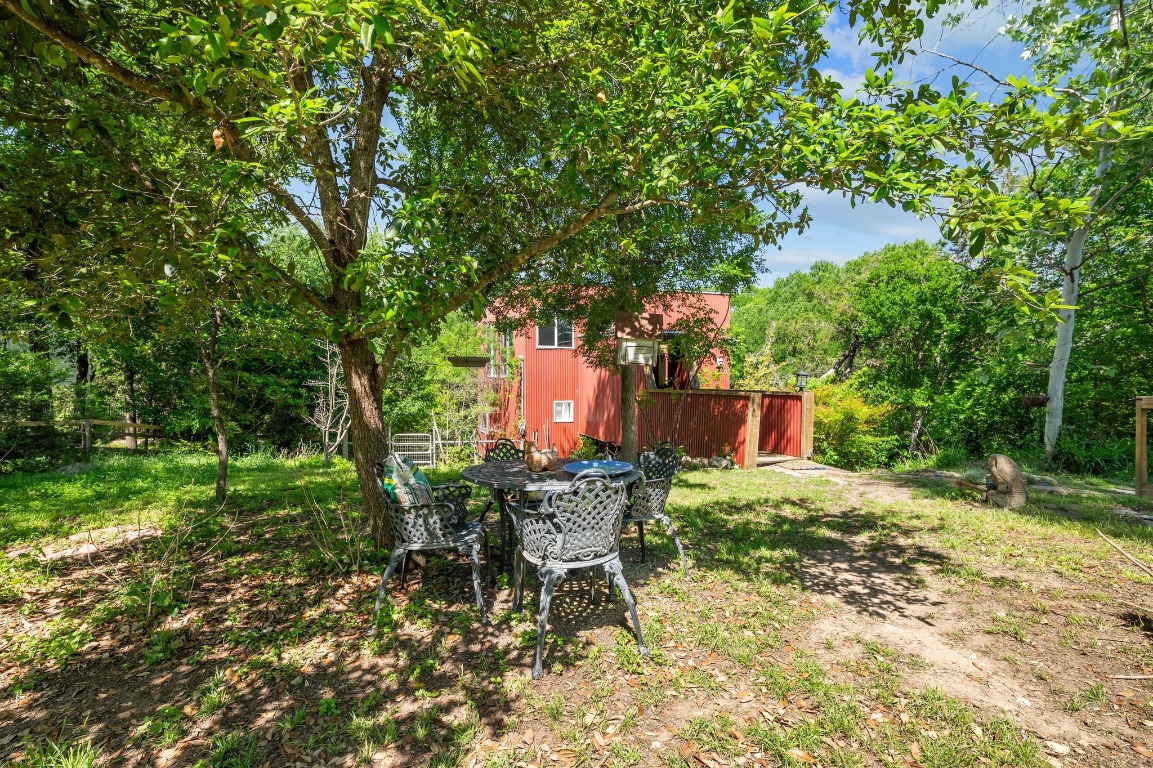 20 North Peak Road West Lake Hills, TX 78746 - Photo 5 of 18 a backyard of a house with table and chairs