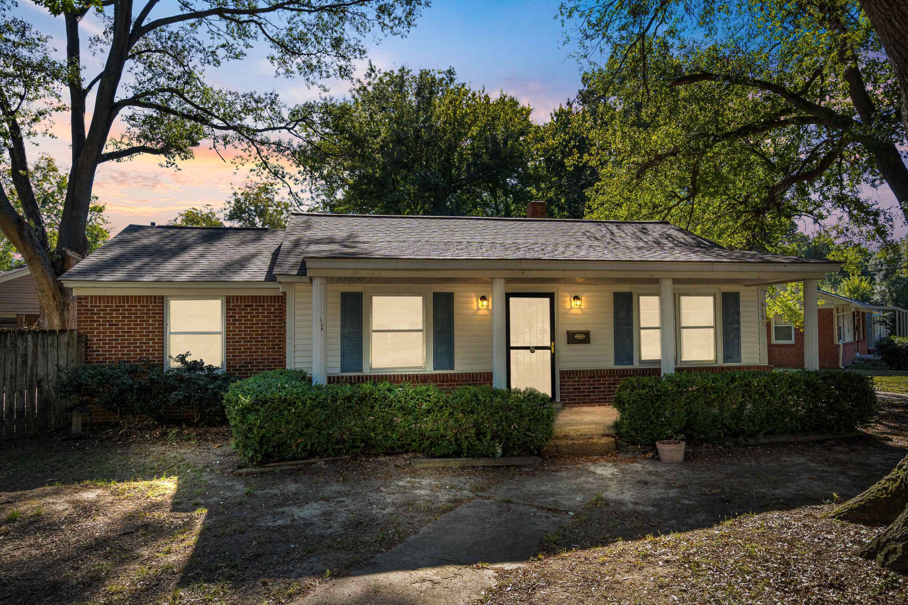 4797 Helene Road Memphis, TN 38117 - Photo 1 of 21 a front view of a house with garden