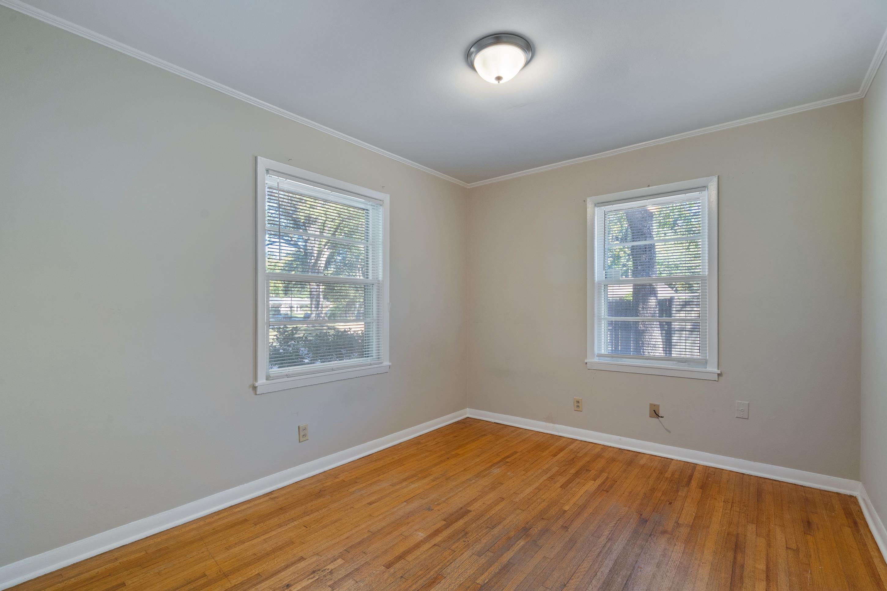 4797 Helene Road Memphis, TN 38117 - Photo 15 of 21 a view of an empty room with wooden floor and a window