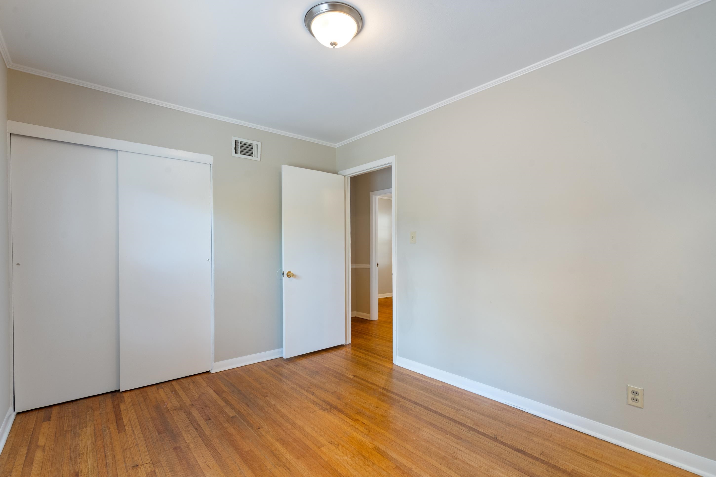 4797 Helene Road Memphis, TN 38117 - Photo 17 of 21 a view of an empty room with wooden floor