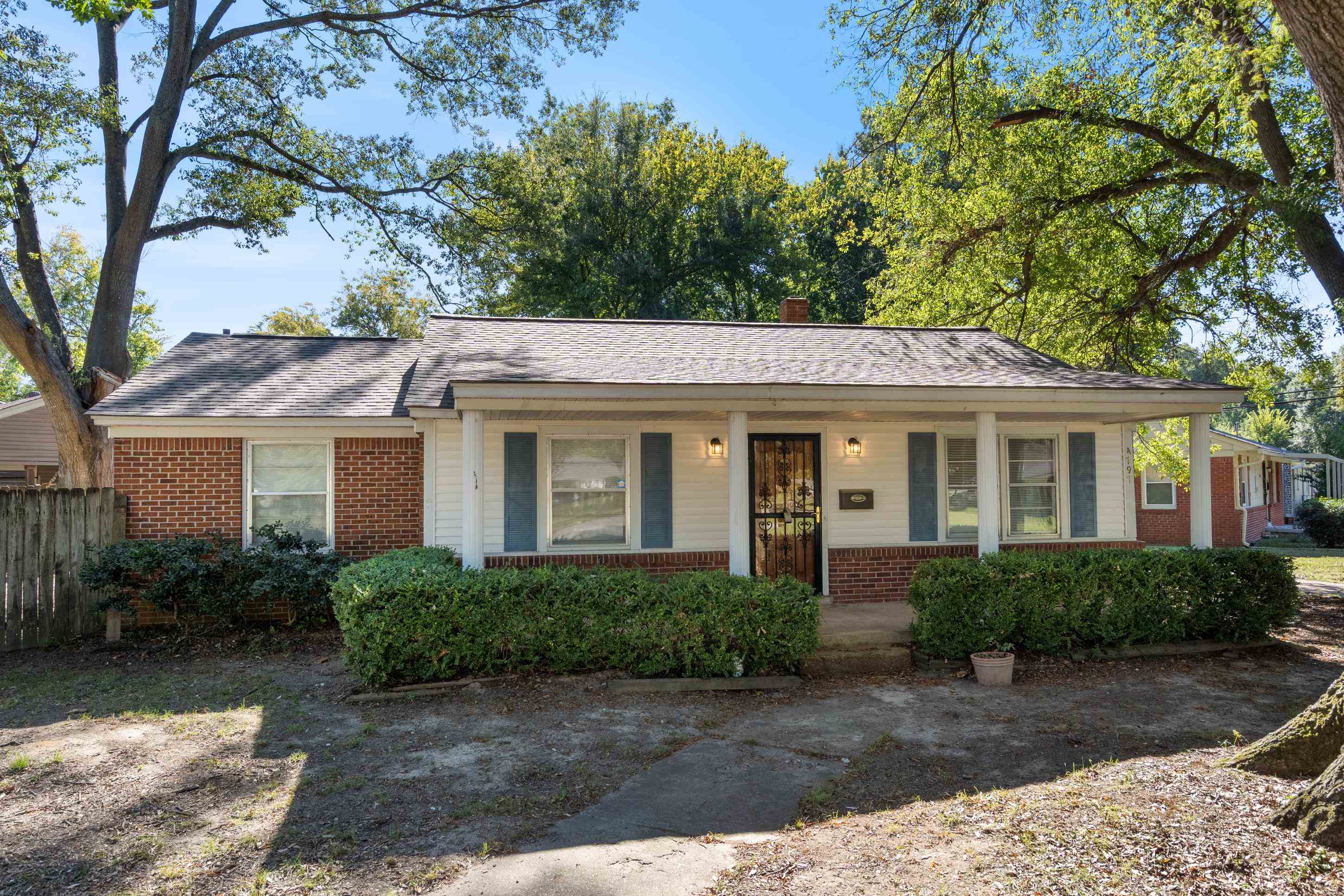 4797 Helene Road Memphis, TN 38117 - Photo 2 of 21 a front view of a house with a garden