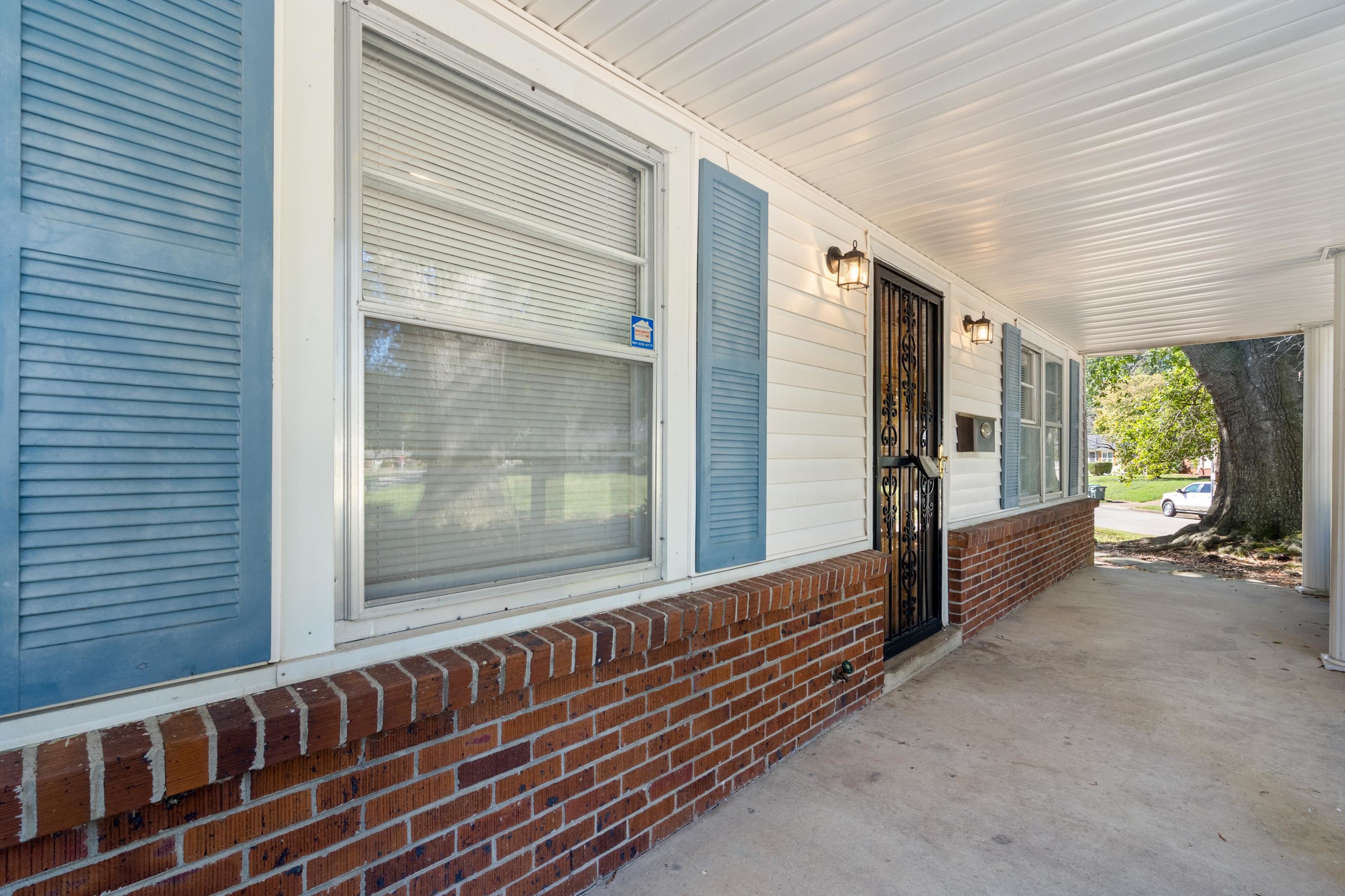 4797 Helene Road Memphis, TN 38117 - Photo 4 of 21 a view of a room with wooden floor and windows