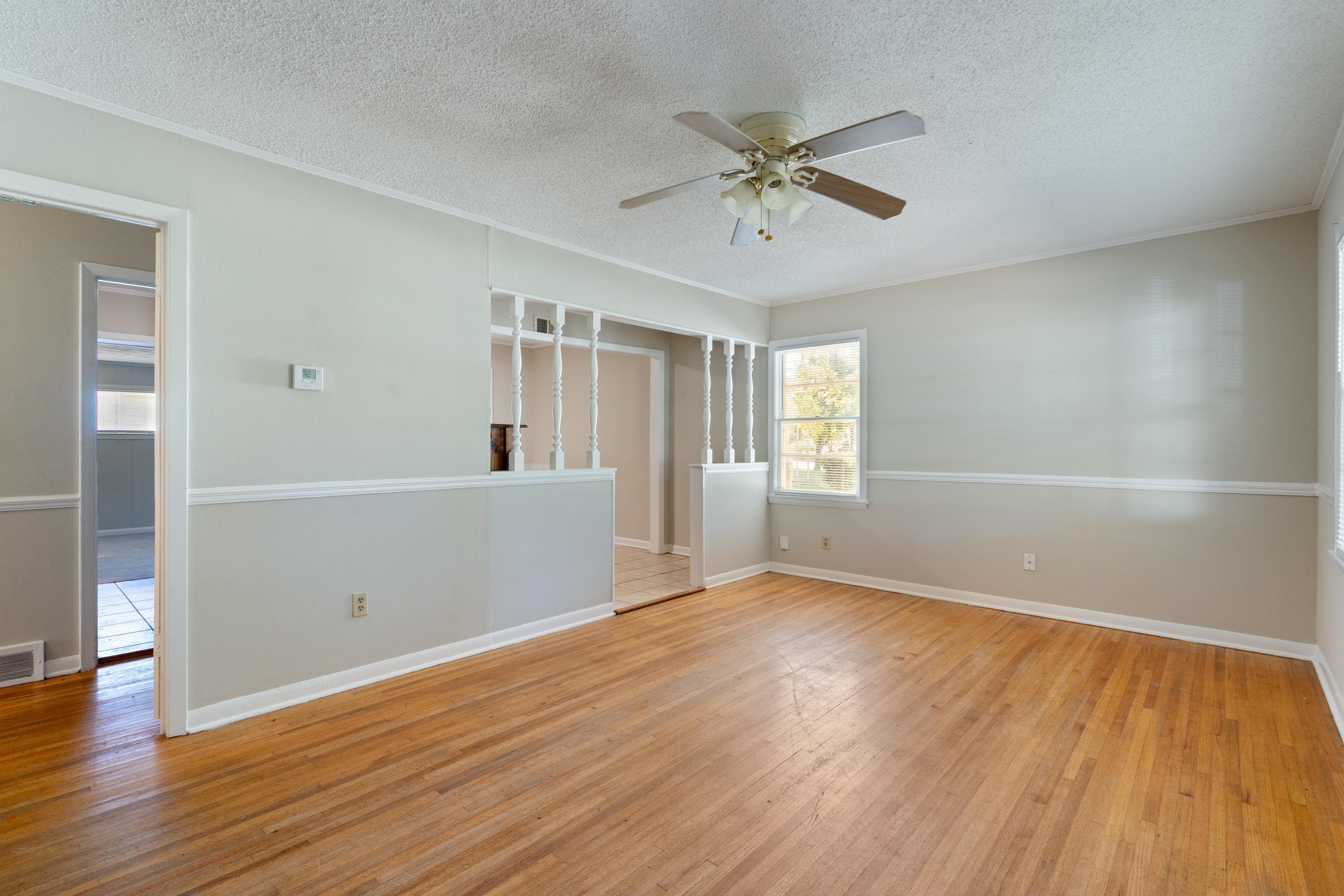 4797 Helene Road Memphis, TN 38117 - Photo 5 of 21 a view of a room with wooden floor and white walls