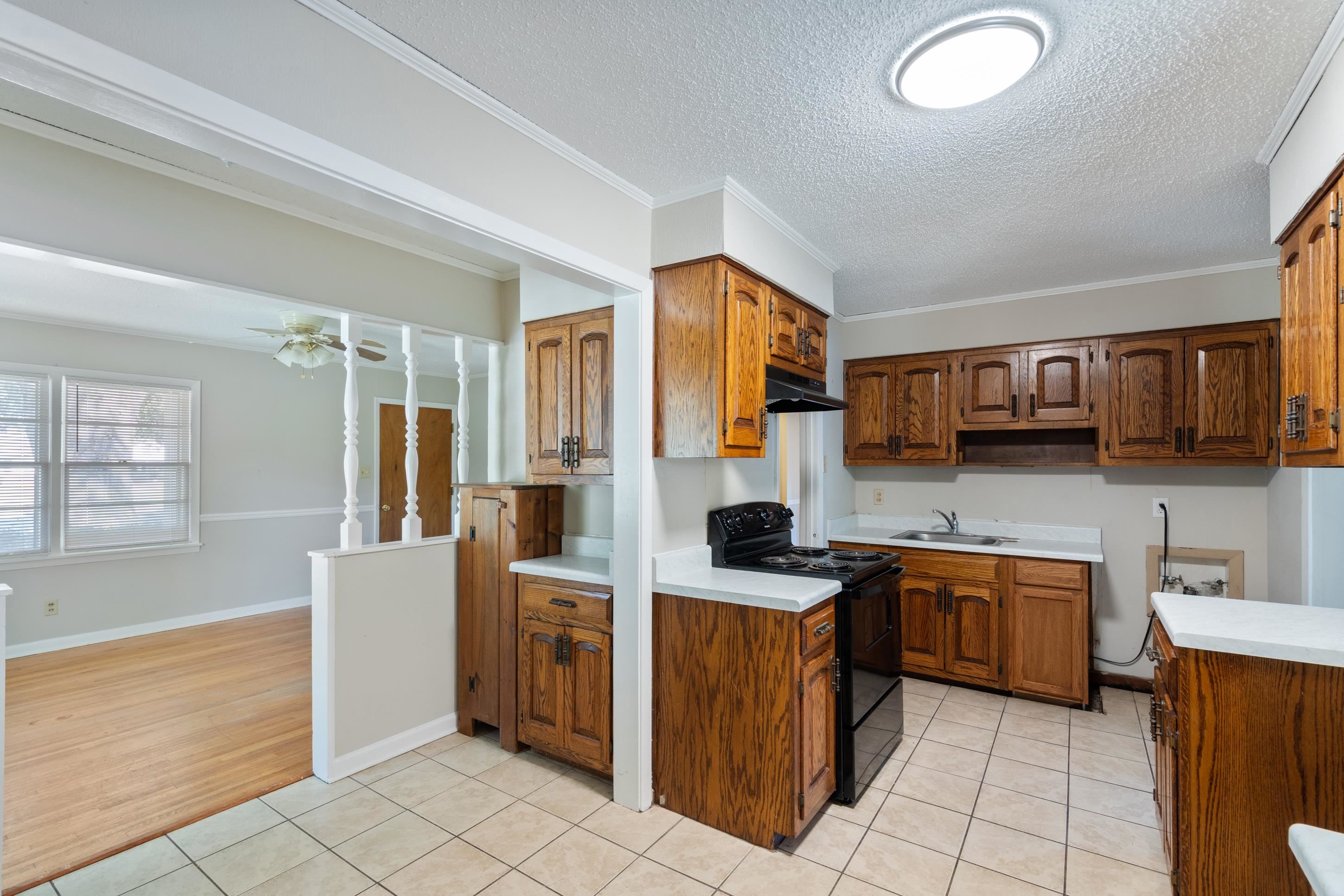 4797 Helene Road Memphis, TN 38117 - Photo 9 of 21 a kitchen with stainless steel appliances a stove a sink and a refrigerator