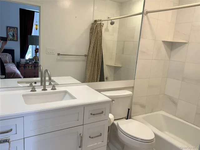 a view of a room with wooden floor and sliding door