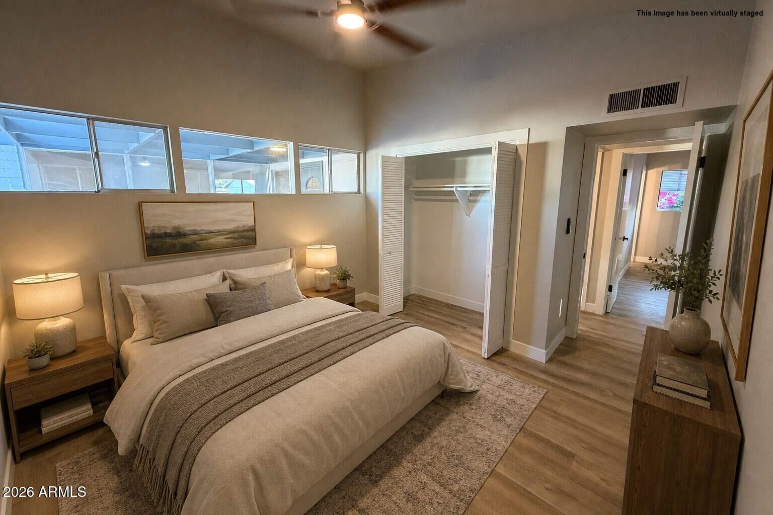 5420 North Granite Reef Road Scottsdale, AZ 85250 - Photo 19 of 30 a bedroom with a bed and a mirror