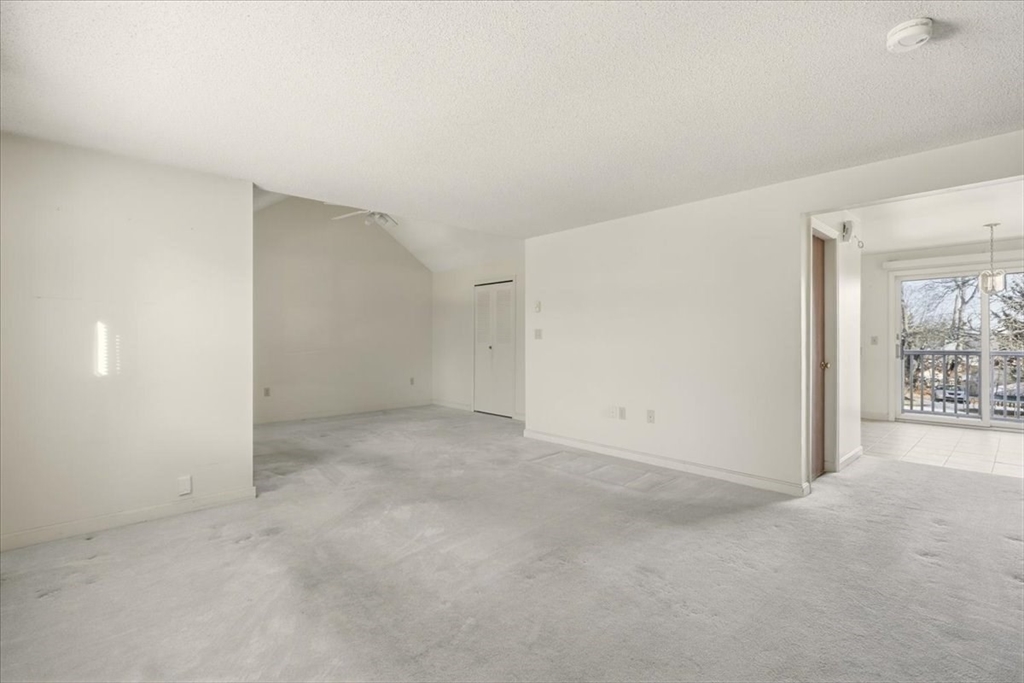 87 Victoria Heights Road, Unit 87 Boston, MA 02136 - Photo 11 of 32 an empty room with windows