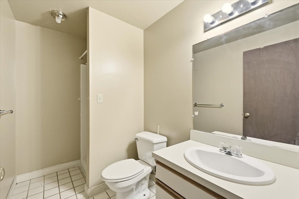 87 Victoria Heights Road, Unit 87 Boston, MA 02136 - Photo 16 of 32 a bathroom with a sink toilet and a mirror