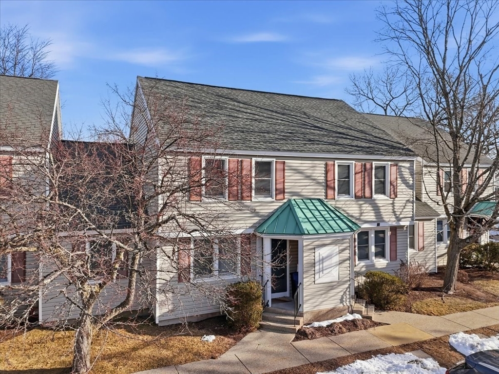 87 Victoria Heights Road, Unit 87 Boston, MA 02136 - Photo 2 of 32 a front view of a house with garden