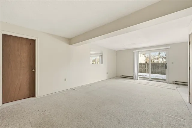 a view of an empty room with a closet