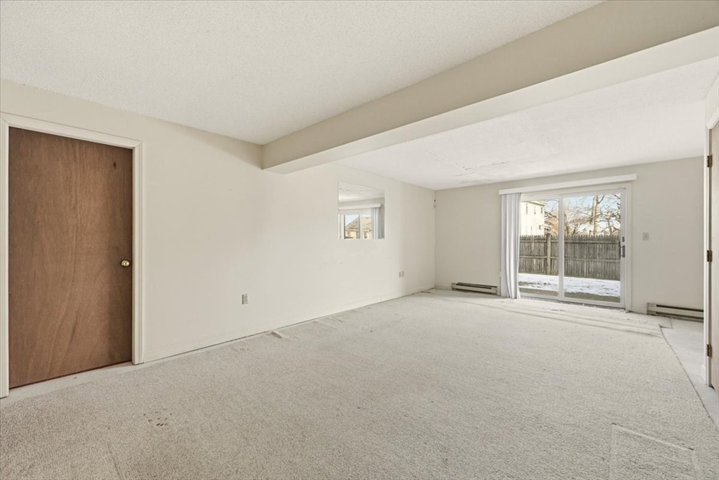 87 Victoria Heights Road, Unit 87 Boston, MA 02136 - Photo 23 of 32 a view of an empty room with a window