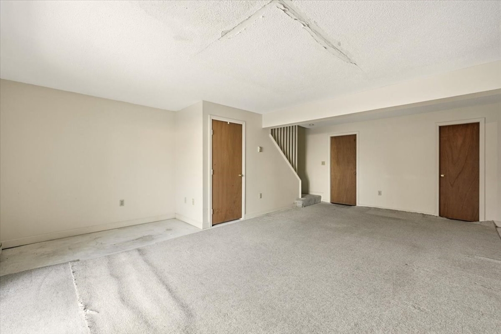 87 Victoria Heights Road, Unit 87 Boston, MA 02136 - Photo 24 of 32 a view of an empty room with a closet