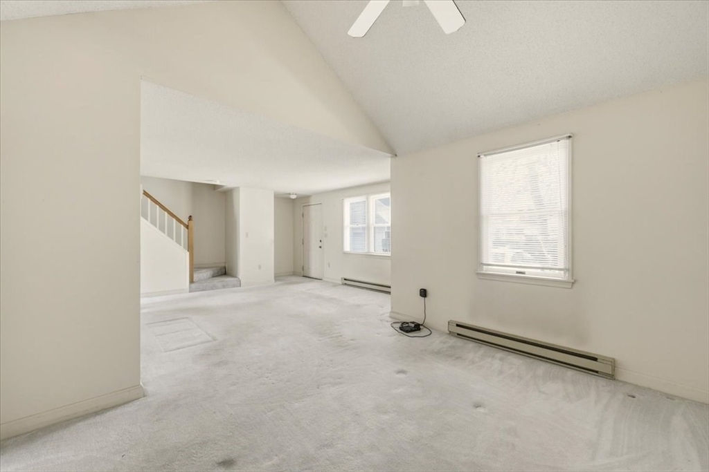 87 Victoria Heights Road, Unit 87 Boston, MA 02136 - Photo 9 of 32 an empty room with windows