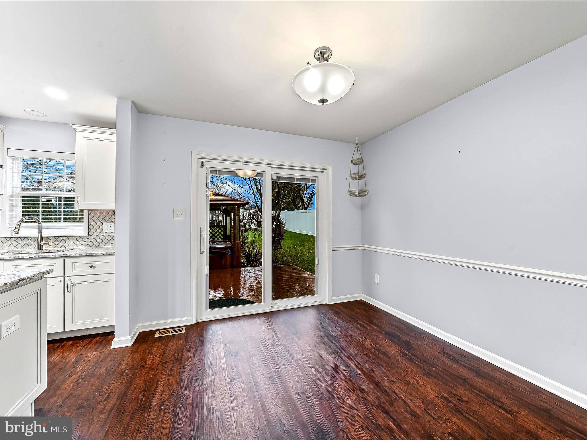 2410 Larkin Road Upper Chichester, PA 19061 - Photo 17 of 50 a view of an empty room with window and wooden floor