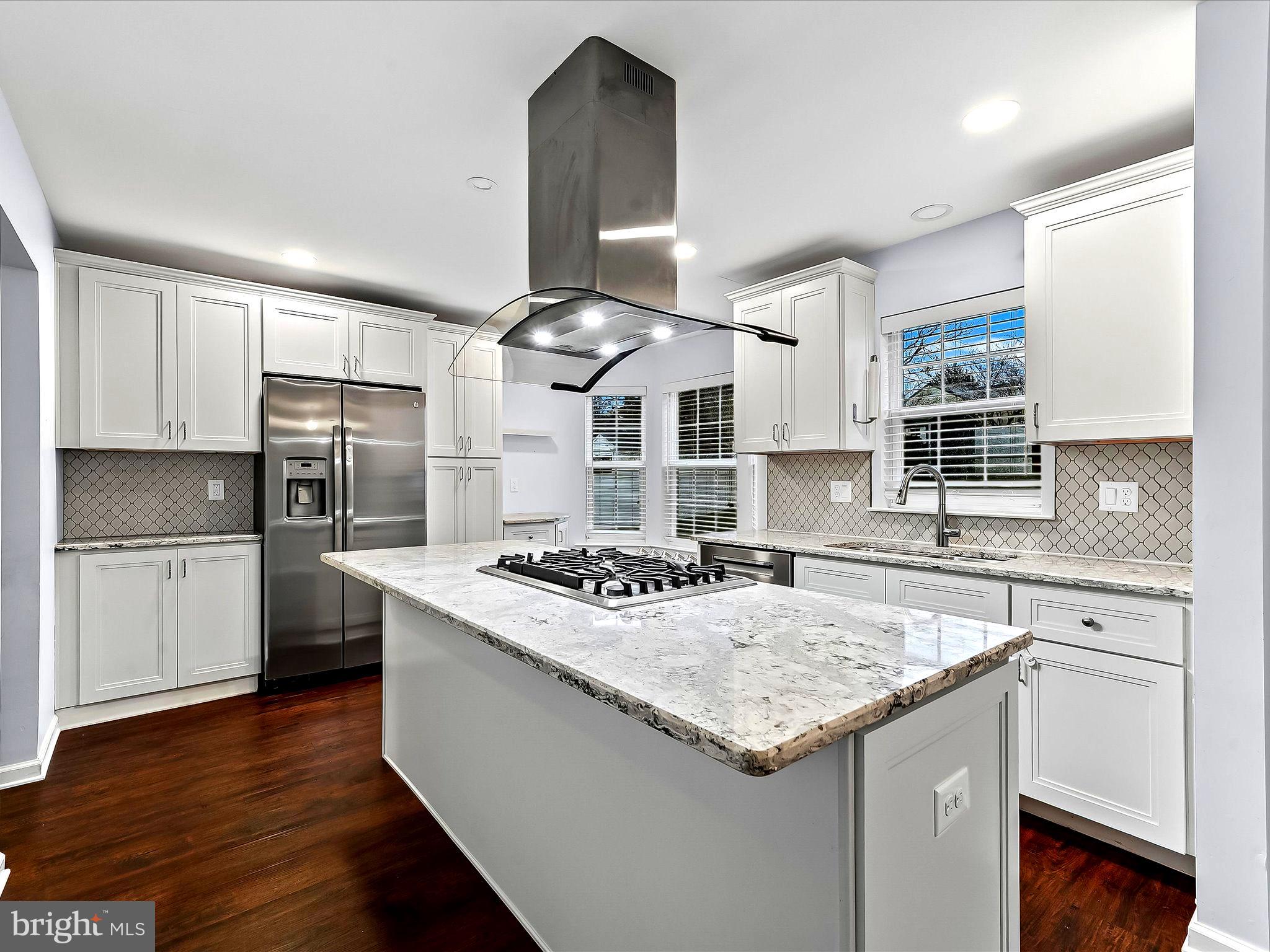 2410 Larkin Road Upper Chichester, PA 19061 - Photo 18 of 50 a kitchen with stainless steel appliances granite countertop a stove and a sink