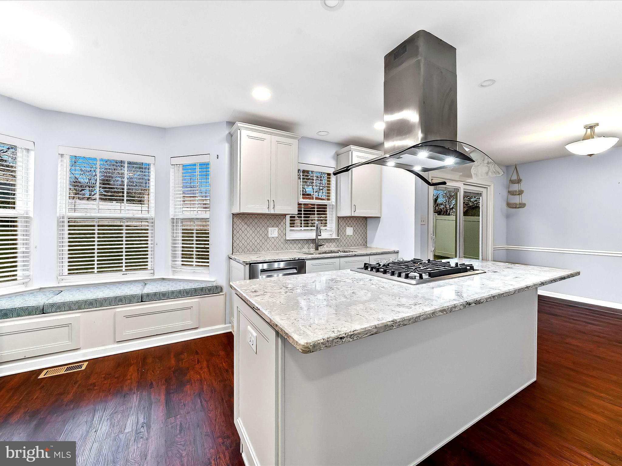 2410 Larkin Road Upper Chichester, PA 19061 - Photo 19 of 50 a kitchen with a stove a sink and a refrigerator