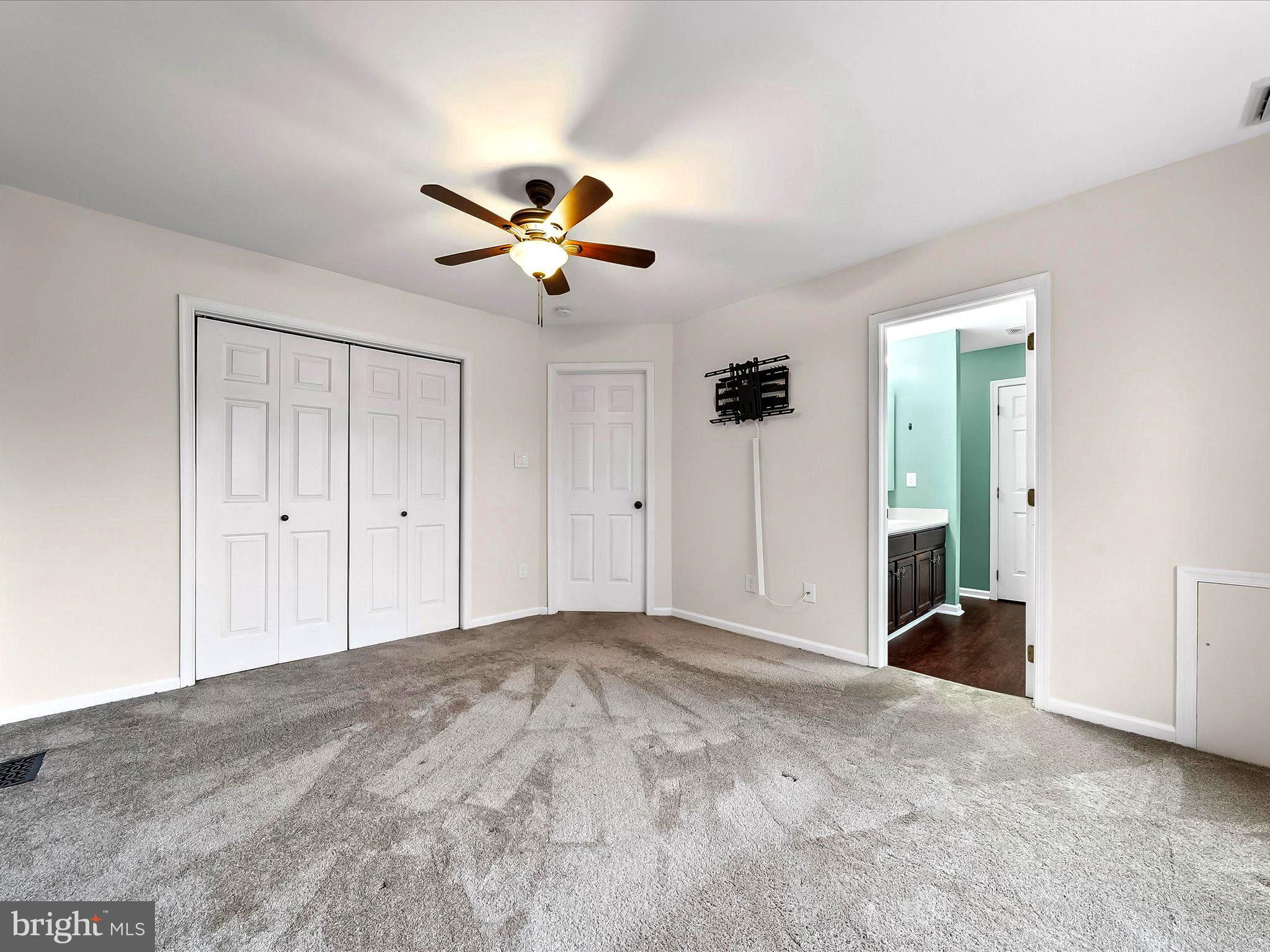 2410 Larkin Road Upper Chichester, PA 19061 - Photo 26 of 50 a view of a big room with chandelier fan and closet area