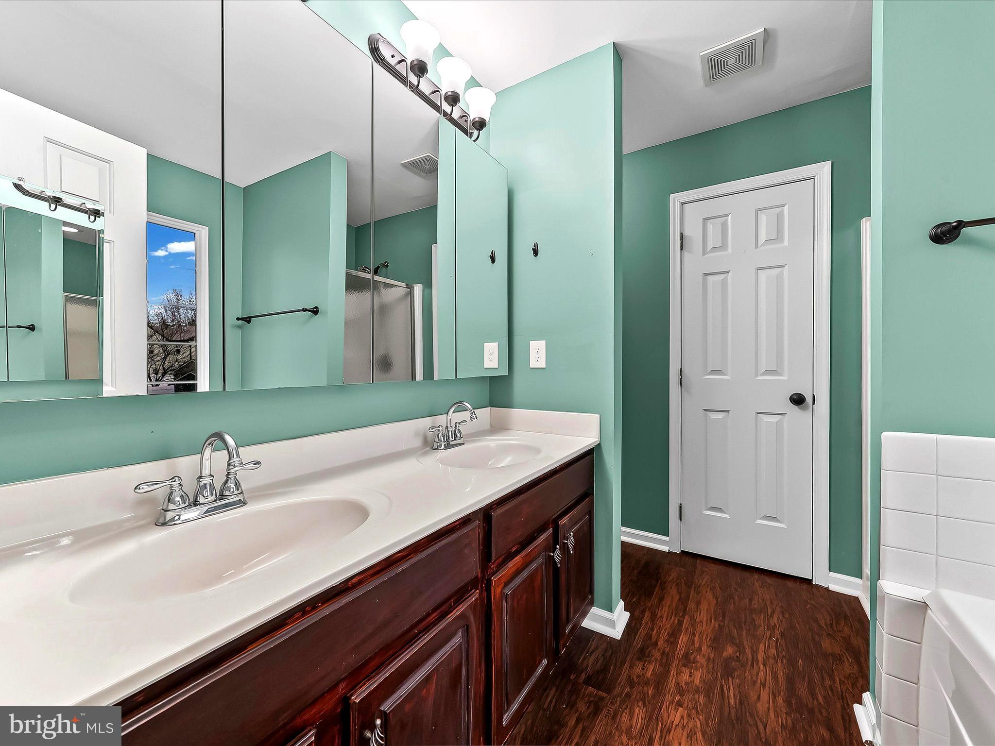 2410 Larkin Road Upper Chichester, PA 19061 - Photo 27 of 50 a bathroom with a sink a toilet and shower