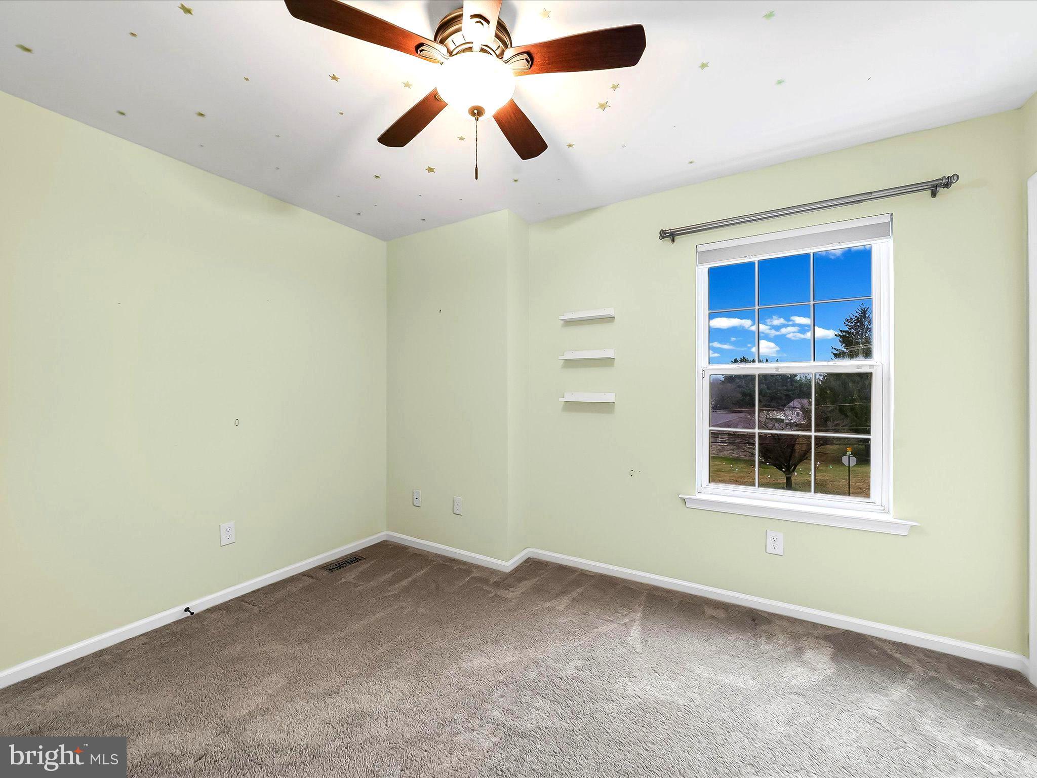 2410 Larkin Road Upper Chichester, PA 19061 - Photo 34 of 50 an empty room with a window and a fan
