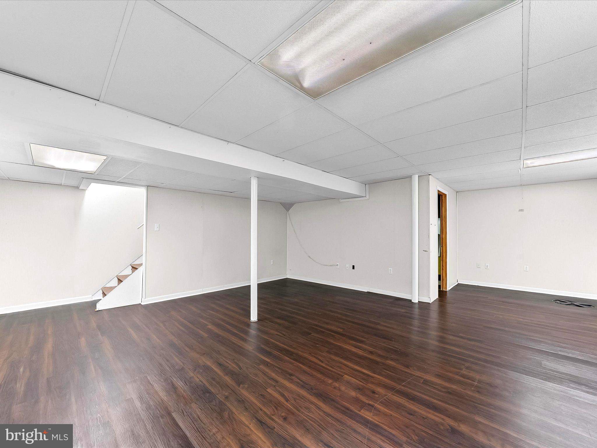 2410 Larkin Road Upper Chichester, PA 19061 - Photo 38 of 50 an empty room with wooden floor